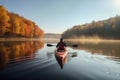 kayaker exploring the serene and peaceful waters of a lake