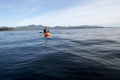 Kayaker fishing in calm water