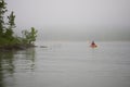 Kayaker On Foggy Lake Royalty Free Stock Photo