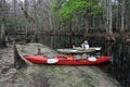 Kayaker and kayak on Fisheating Creek, Florida.