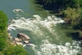 Kayaker looks tiny navigating the rapids of the New River Royalty Free Stock Photo