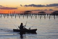 Kayaker Paddles to Shore at Sunset