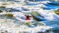 Kayaker navigating through the White Waters of the Thompson River
