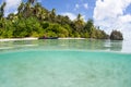 Kayaker and Remote Beach in Raja Ampat