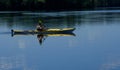 Kayaker Paddling on Calm Peaceful Body of Water