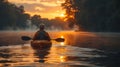 Kayaker Paddling Down River at Sunset Royalty Free Stock Photo