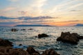 Kayaker paddling the kayak at sunset sea. Kayaking, canoe, paddling. Amazing beach sunset with endless horizon and Royalty Free Stock Photo