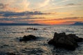 Kayaker paddling the kayak at sunset sea. Kayaking, canoe, paddling. Amazing beach sunset with endless horizon and Royalty Free Stock Photo