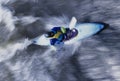 Kayaker Paddling Through Rapids