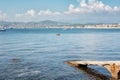 Kayaker resting in the Golfe Juan with in the background the hotels of the French city of Juan-les-Pins