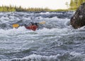 Kayaker turning over in whitewater Royalty Free Stock Photo