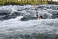 Kayaker turning over in whitewater Royalty Free Stock Photo