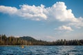 Kayaker under big puffy clouds Royalty Free Stock Photo