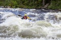 Kayaker in whitewater on a Karelian river Royalty Free Stock Photo