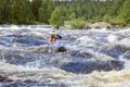 Kayaker in whitewater on a Karelian river Royalty Free Stock Photo