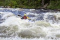 Kayaker in whitewater on a Karelian river Royalty Free Stock Photo