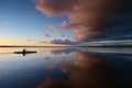 Kayakers on Coot Bay in Everglades National Park under dramatic sunset clouds. Royalty Free Stock Photo