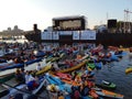 Kayakers in front of a floating stage