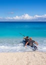 Kayakers on the kayak and a beautiful yacht in the background of clouds on the island of Kefalonia in the Ionian Sea in Greece Royalty Free Stock Photo