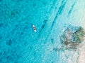 Kayakers on kayak floating in blue transparent sea. Aerial view