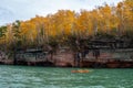 Kayakers make their way through the sea caves at the Apostle Islands National Lakeshore in Wisconsin Royalty Free Stock Photo