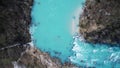 Kayakers paddling on river Soca on a Winter day. Top Down Drone Photo.