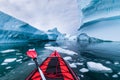 Kayaking in Antarctica between icebergs with inflatable kayak, extreme adventure in Antarctic Peninsula , beautiful pristine