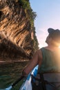 Kayaking around hight amazing Limestone Rocks at Railey Beach in Krabi, Thailand. Sunset Time