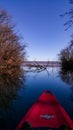 Living a healthy life while paddling a brand new kayak from Nomad on the luster of water in spring season