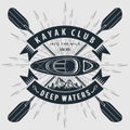 Kayaking club emblem, kayak and crossed paddles
