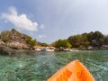 kayaking in crystal clear tropical waters - kayak heading to isolated beach in Ko Tarutao national park