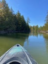 Kayaking down the Manistique River through a forest in Germfask, Michigan Royalty Free Stock Photo