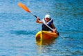 Kayaking lessons. Boy with life buoy suit in kayak lessons duri