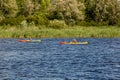 Kayaking on the river in clear weather Royalty Free Stock Photo