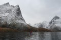 Kayaking into a snowy Reinefjorden Royalty Free Stock Photo