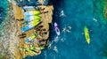 Kayaking. Sup. Aerial view of floating board and people on blue sea at sunny day. Travel and active life image. Royalty Free Stock Photo