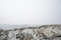 Kayakers on a lake in thick fog