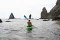 Woman kayak sea. Happy tourist enjoy taking picture outdoors for memories. Woman traveler posing in kayak canoe at sea Royalty Free Stock Photo