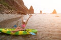 Woman kayak sea. Happy tourist enjoy taking picture outdoors for memories. Woman traveler posing in kayak canoe at sea Royalty Free Stock Photo