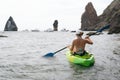 Woman kayak sea. Happy tourist enjoy taking picture outdoors for memories. Woman traveler posing in kayak canoe at sea Royalty Free Stock Photo