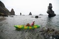 Woman kayak sea. Happy tourist enjoy taking picture outdoors for memories. Woman traveler posing in kayak canoe at sea Royalty Free Stock Photo