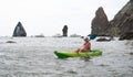 Woman kayak sea. Happy tourist enjoy taking picture outdoors for memories. Woman traveler posing in kayak canoe at sea Royalty Free Stock Photo