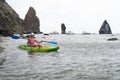 Woman kayak sea. Happy tourist enjoy taking picture outdoors for memories. Woman traveler posing in kayak canoe at sea