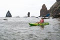 Woman kayak sea. Happy tourist enjoy taking picture outdoors for memories. Woman traveler posing in kayak canoe at sea