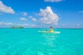 Kayaking in tropical paradise - Canoe floating on transparent turquoise water, caribbean sea, Belize, Cayes islands Royalty Free Stock Photo