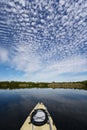 Kayaking under beautiful summer cloudscape reflected on Nine Mile Pond in Everglades National Park, Florida.