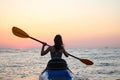 Kayaking Woman in kayak. Girl Rowing in the water of a calm sea Royalty Free Stock Photo