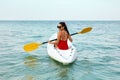 Kayaking. Woman Traveling In Canoe At Sea Back View