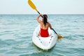 Kayaking. Woman Traveling In Canoe At Sea Back View