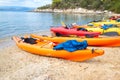 Kayaks arranged on the beach in Greece.